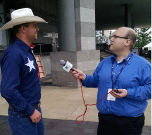 Westwood One News correspondent Alan Scaia interviews Texas delegation member outside Quicken Loans Arena.