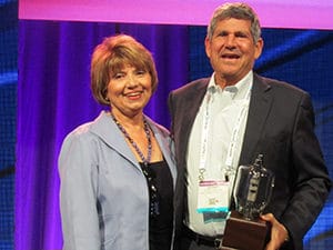 Radio Ink Publisher Deborah Parenti with Emmis Chairman/CEO Jeff Smulyan, the 2016 Radio Wayne winner for America's Best Broadcaster