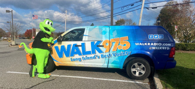 Long Island Cares mascot "Aspara Gus" poses with the Walk 97.5 FM truck. (Courtesy photo)
