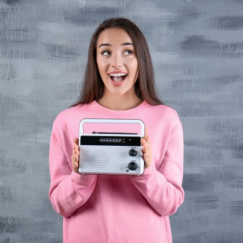 Woman holding Radio