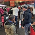 Morning RollOut Clay assisting children to pick out their coats