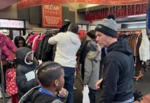 Morning RollOut Clay assisting children to pick out their coats