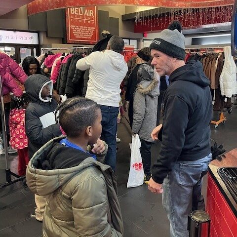 Morning RollOut Clay assisting children to pick out their coats