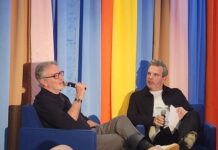 Two men in conversation on stage at the Broadcasters Foundation of America Media Mixer in Chicago