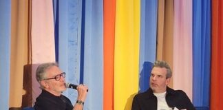 Two men in conversation on stage at the Broadcasters Foundation of America Media Mixer in Chicago