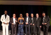 Radio Hall of Fame Class of 2026 inductees holding their awards on stage in Chicago